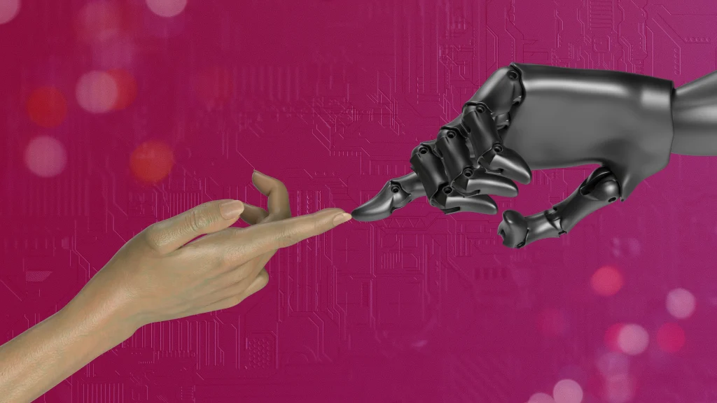 Human-in-the-loop operations – symboliczne przedstawienie współpracy człowieka i sztucznej inteligencji, z ludzką dłonią i robotycznym ramieniem dotykającymi się na tle technologicznego interfejsu.